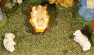 This is a vintage nativity scene with 10 figures that have been glued 