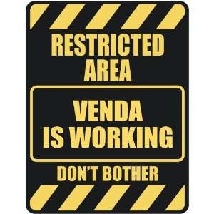   RESTRICTED AREA VENDA IS WORKING  PARKING SIGN