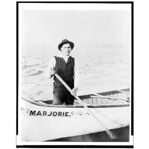   standing in canoe, in the Sault Sainte Marie region of Michigan 1903