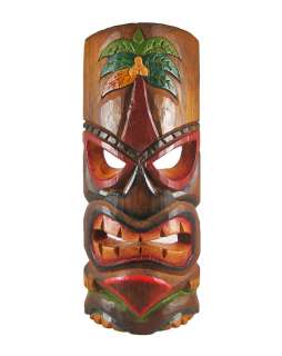 this awesome looking tiki wall mask with a menacing grimace on