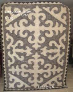 This shyrdak rug handmade by woman community in mountainous village 