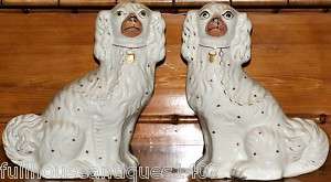 Pair of white Staffordshire dogs  
