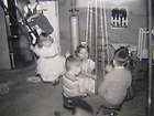 Vintage Photograph Young Kids Play on Indoor Swing Set